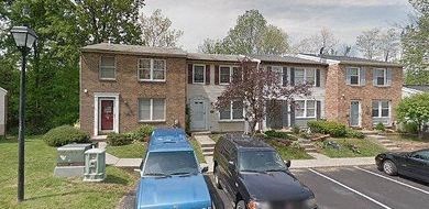 a house with cars parked in front of it