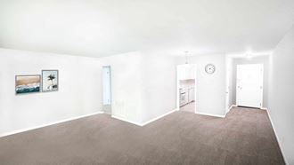 an empty living room with white walls and a brown rug