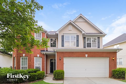 a house with a white garage door in front of it