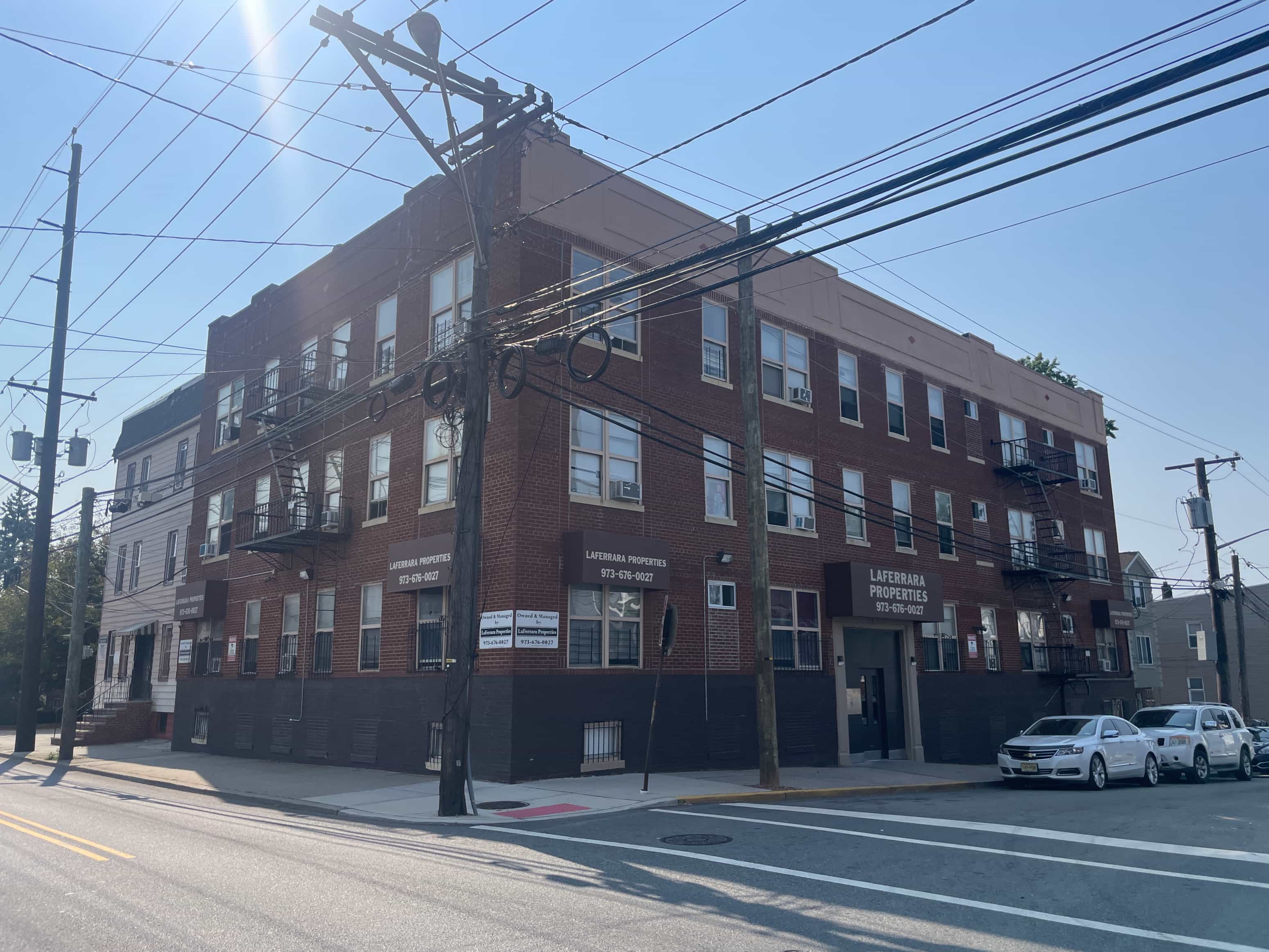 A large brick building with a sign that says "Leisure Products" on it.