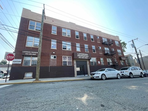 A red brick building with a sign that says Lafferty Properties.