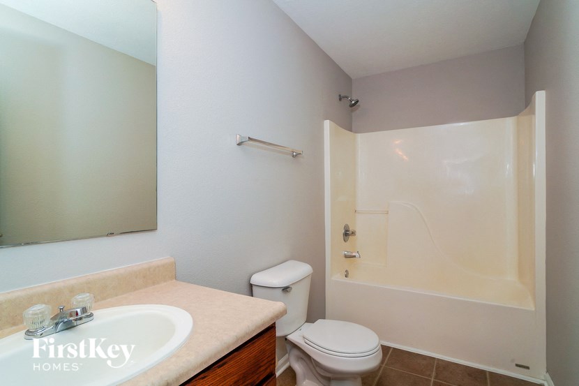 a bathroom with a sink toilet and a shower