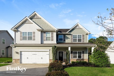 A two-story house with a garage is for sale by FirstKey Homes.