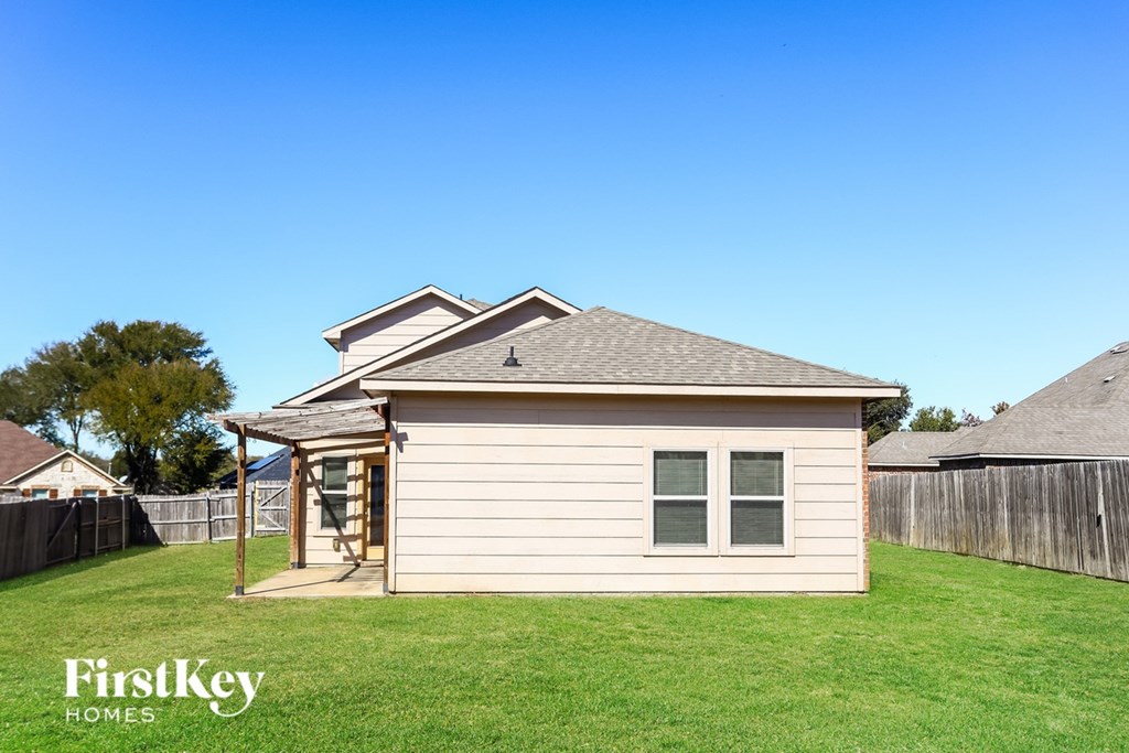 A small house with a brown roof and a white wall is shown with a logo of FirstKey Homes on the bottom left.
