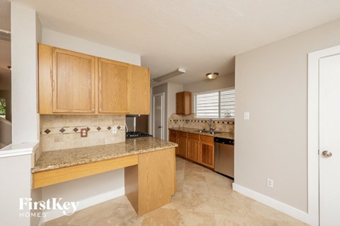 a kitchen with wooden cabinets and a counter top