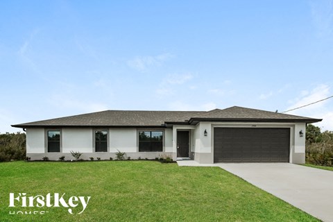 a brand new house with a garage door