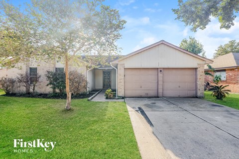 a house with a driveway and a garage door