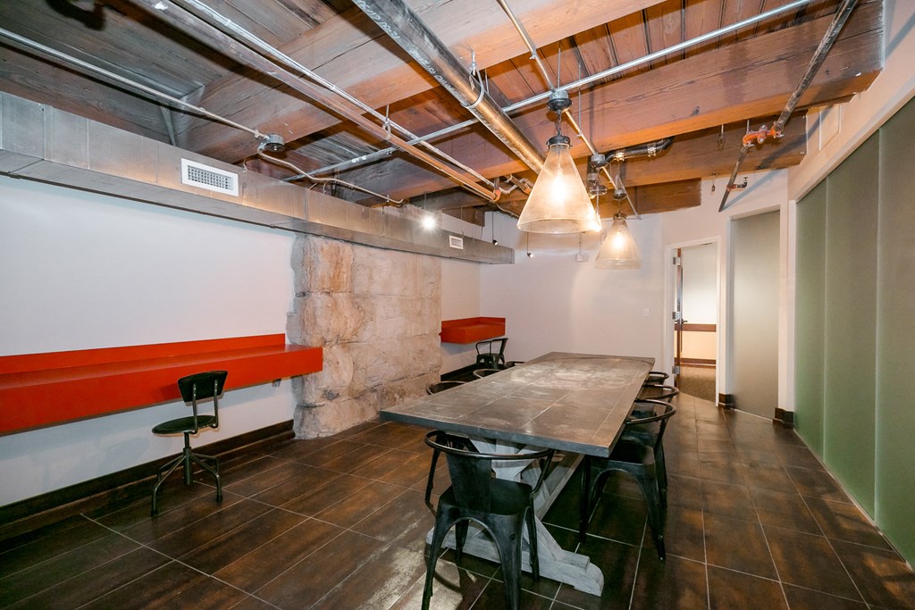 a conference room with a long table and chairs