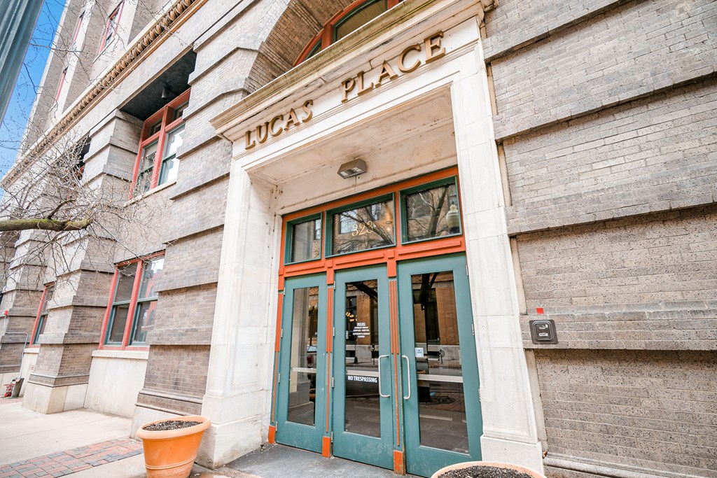 the front of tacos place on the corner of a city street