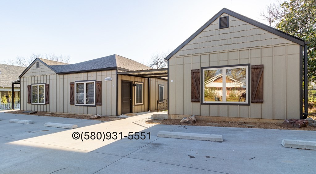 A house with a brown and beige exterior is shown.