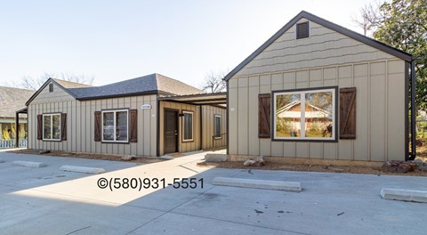 A house with a brown and beige exterior is shown.