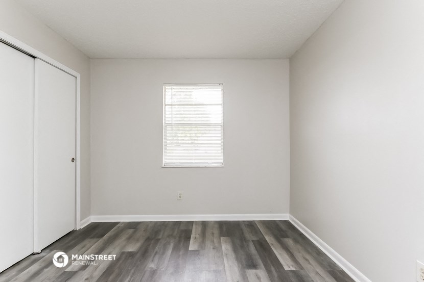 the preserve at ballantyne commons apartment living room with wood flooring and window
