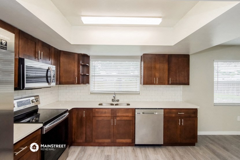 the preserve at ballantyne commons apartment kitchen with wooden cabinets