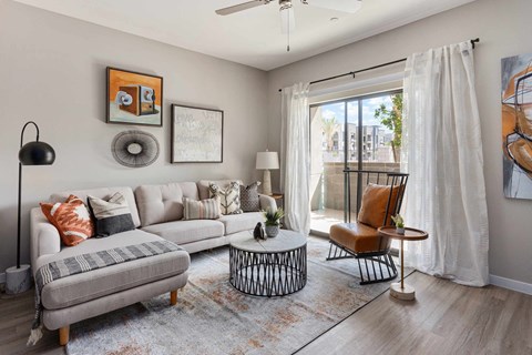 a living room with a couch and a sliding glass door