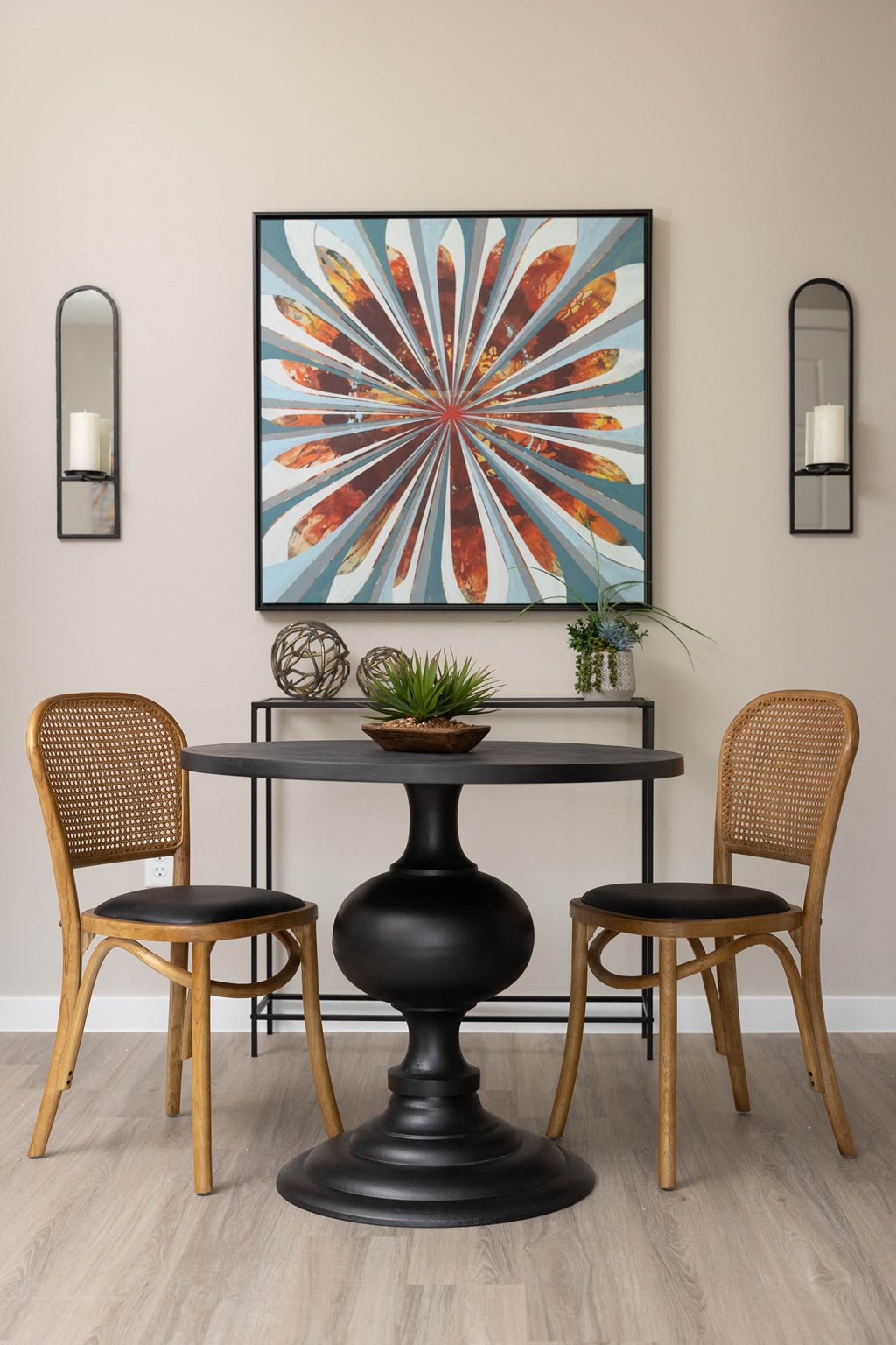 a dining room with a table with chairs and a