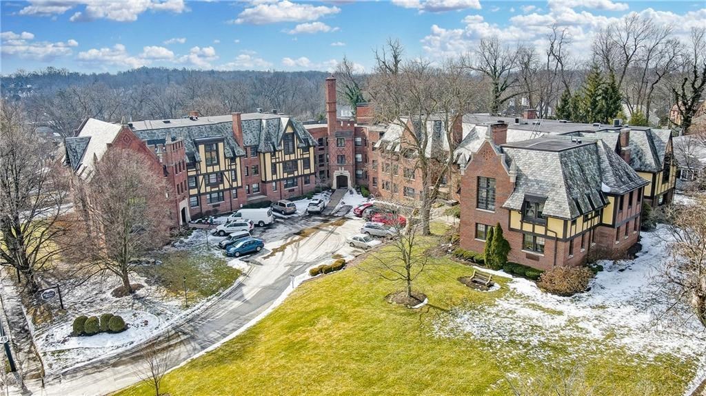 an aerial view of an apartment building in the snow