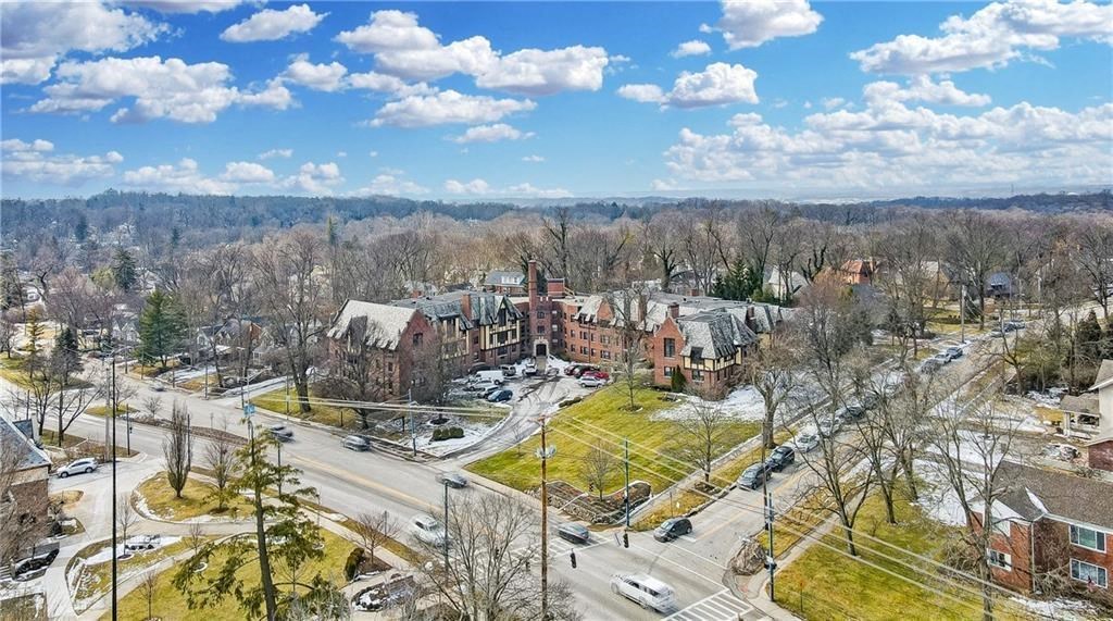 an aerial view of a large campus with trees and buildings