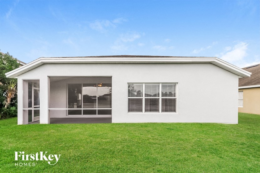 a white house with a lawn in front of it