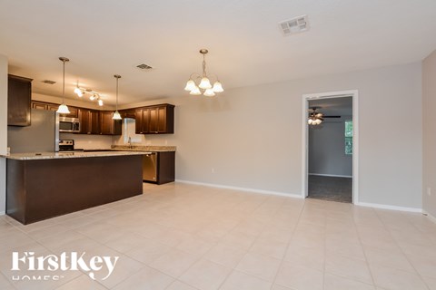 A spacious kitchen with a bar area and a large island.