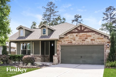 a house with a garage door in front of it