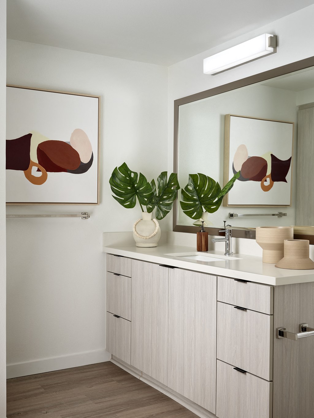 a white bathroom with a sink and a mirror
