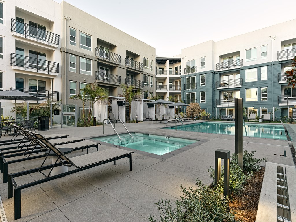 a swimming pool in the middle of an apartment building