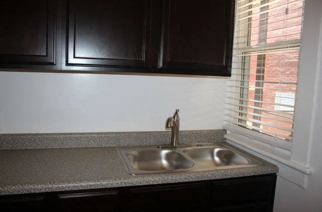 a kitchen with a sink and a window