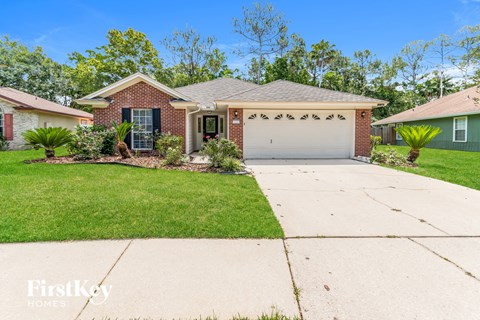 a home with a driveway and a garage door