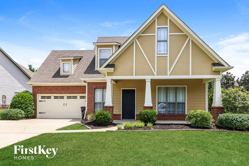 a house with a lawn in front of it