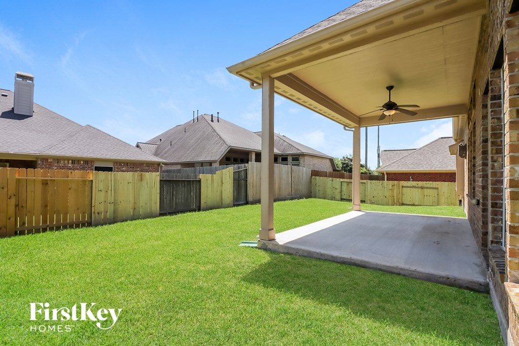 A house with a covered patio area is for sale.