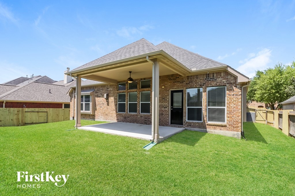 A house with a covered patio is for sale by FirstKey Homes.