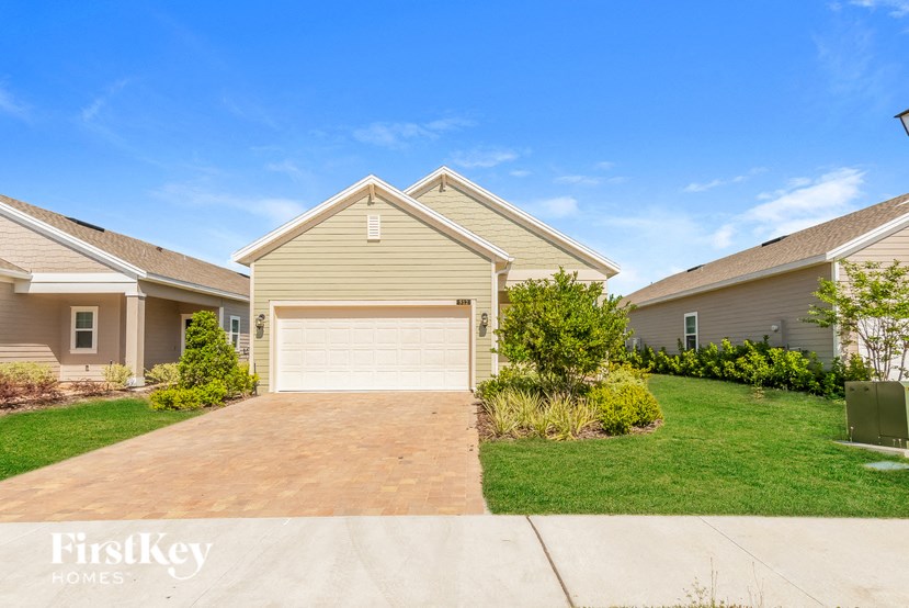 A house with a garage is for sale by FirstKey Homes.