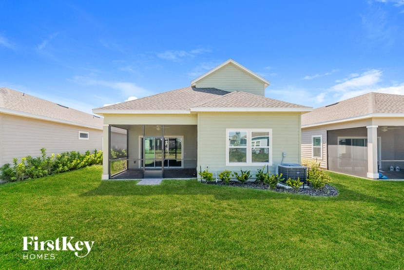 A house with a lawn and a clear blue sky.