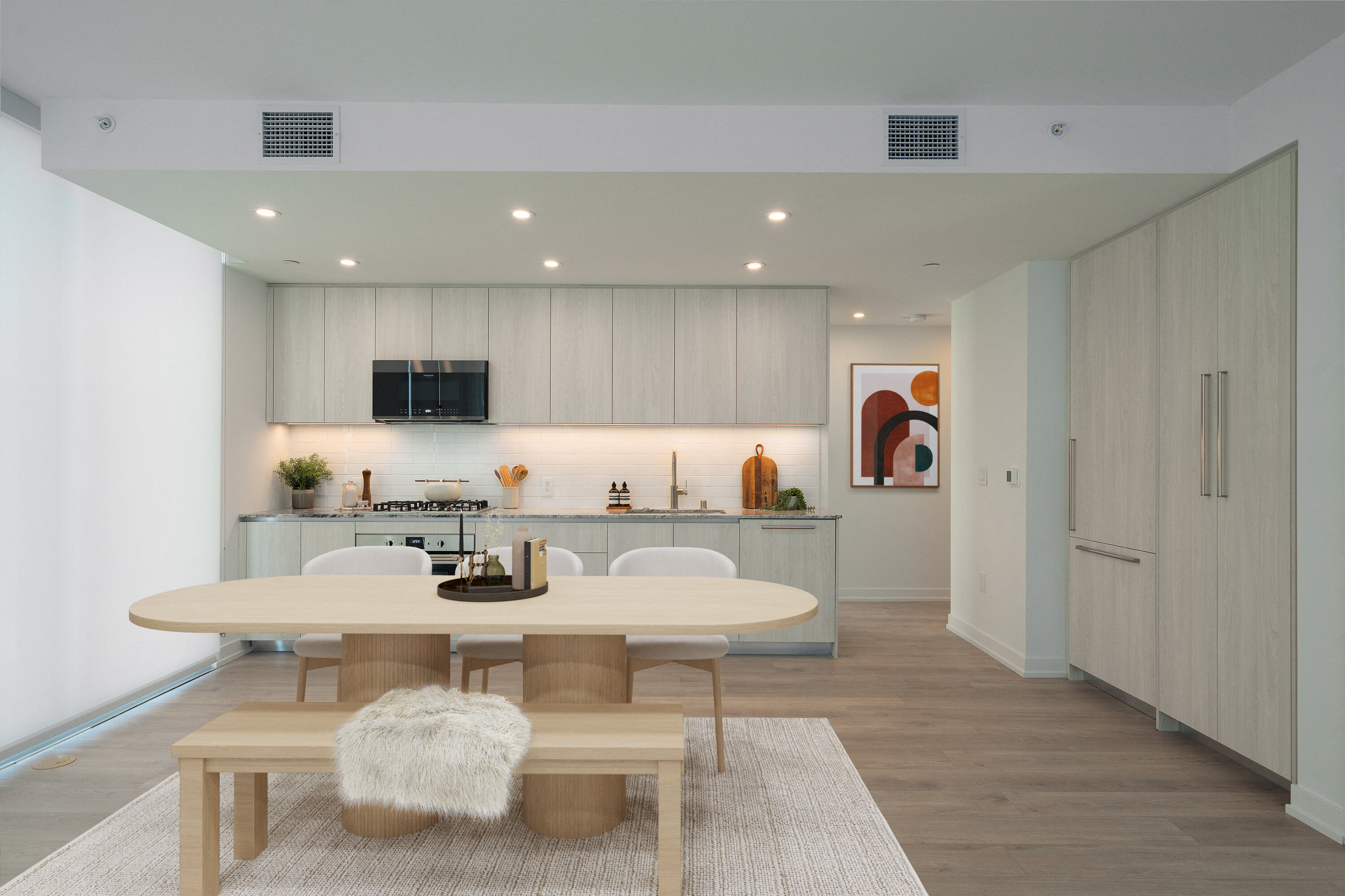 A modern dining room with a white table and bench.