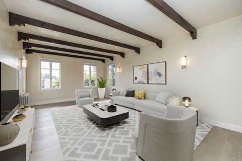 A living room with a grey sofa and a coffee table.