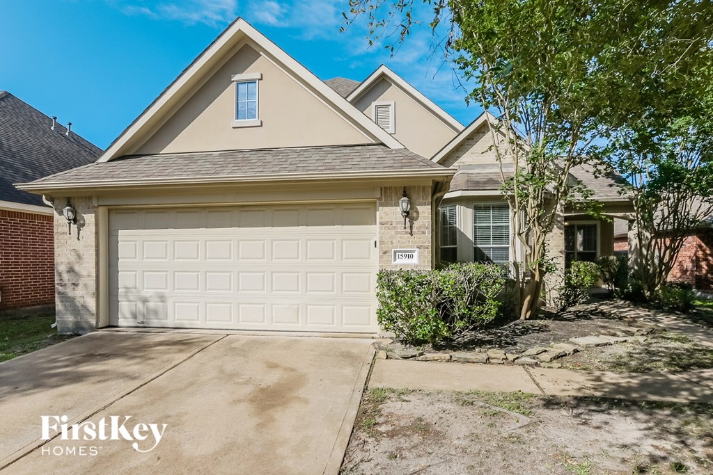 A house with a garage is for sale.