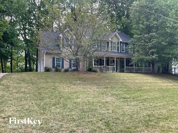 a house with a large yard and a tree