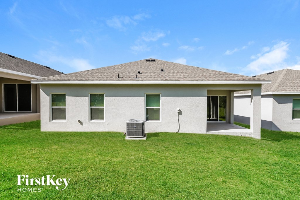 a white house with a grassy yard and a mailbox