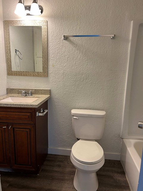 a bathroom with a toilet and a sink