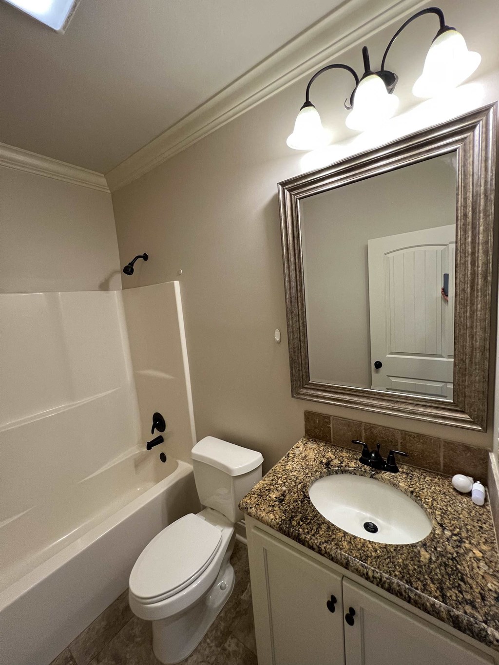 a bathroom with a sink toilet and a bath tub