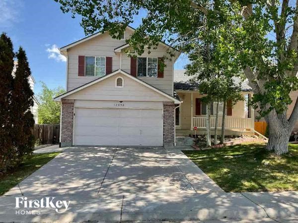 a white house with a white garage door