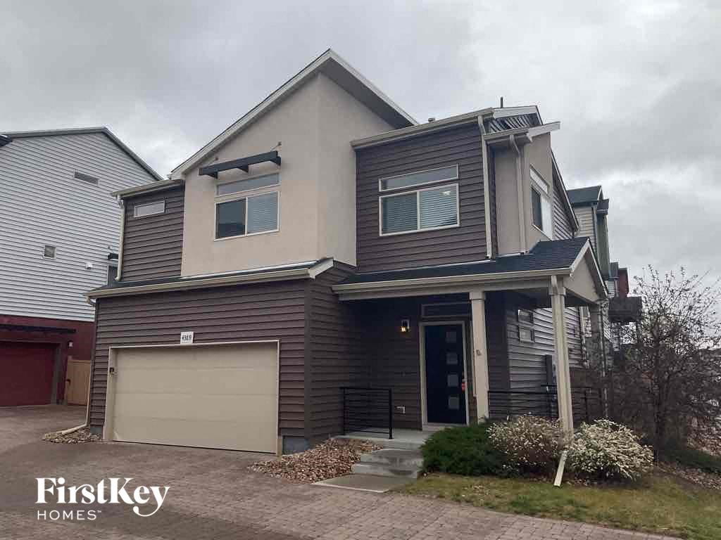 a brown and with a garage door