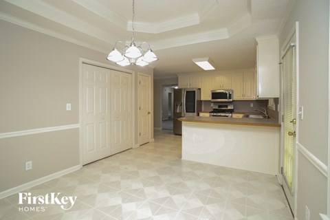 A kitchen area with a checkered floor and a counter.
