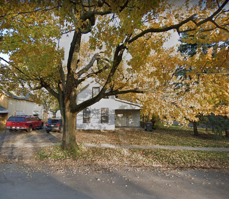 a house with a tree in front of it
