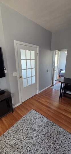 A room with a door and a table.