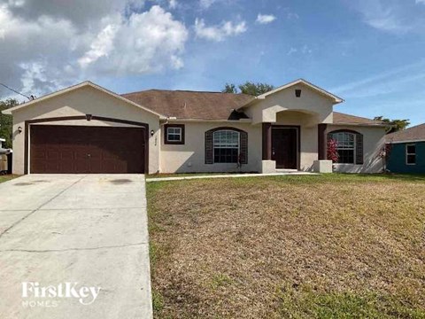 a house with a driveway and a garage door