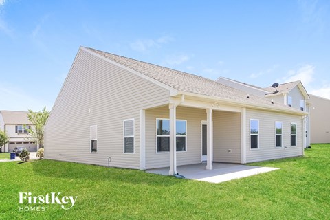 A house with a white exterior and a covered porch.
