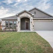 a house with a driveway and a garage door