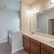 a bathroom with a sink and a toilet and a mirror