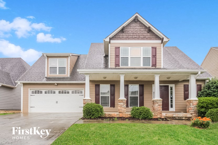 A house with a garage and a covered porch.